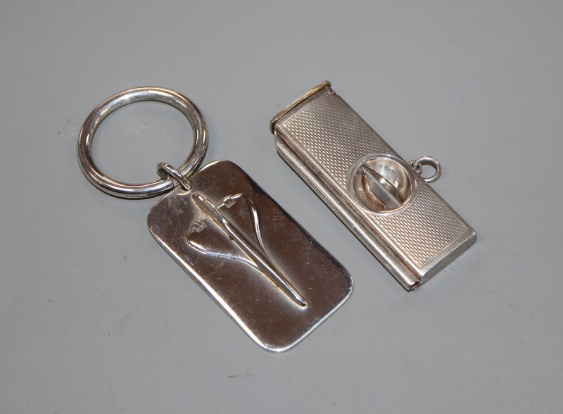 A modern silver concord key ring and a silver mounted cigar cutter.